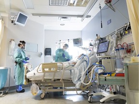 A patient receives treatment at the COVID unit at Vancouver General Hospital.