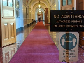 The B.C. Legislature remained closed to the public Monday. Inside, numerous signs warning MLAs and staff to keep at least six feet of physical distance were posted throughout the building's red-carpeted corridors. Photo: Rob Shaw