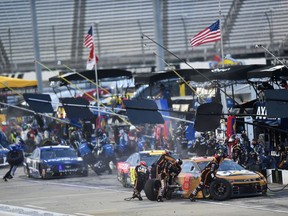 Tyler Reddick's team works on his car during the NASCAR Cup Series Blue-Emu Maximum Pain Relief 500 at Martinsville Speedway on June 10, 2020 in Martinsville, Va.