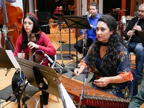 Marjan Alekhamis and Saina Khaledi, shown here in the recording studio on alto qaichak and santur respectively, are part of the Vancouver Inter-Cultural Orchestra. The ensemble has a new album out. Photo: Alistair Eagle