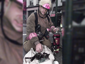 Longtime Vancouver firefighter Capt. Steve Letourneau, who died Wednesday at the age of 59, is pictured in this 1998 Vancouver Sun file photo resuscitating a kitten rescued from a fire.