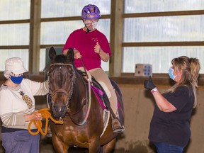 Rider Crystal Stobbe takes part in the Therapeutic Equestrian Association (VTEA) program in Aldergrove. The VTEA has created a horse-therapy program for front-line pandemic workers.