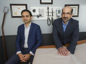 Dr. Navid Pooyan (left) and Dr. Vahid Nilforushan at the Nova Care Clinic in Coquitlam. The pair are part of a group of foreign-trained doctors that have filed a complaint with the B.C. human Rights Tribunal against the provincial government, UBC, the College of Physicians and Surgeons and two others, challenging what they say is a discriminatory licensing system for doctors.