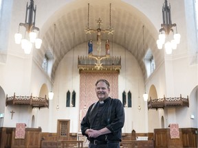 Anglican priest Father Matthew Johnson stands inside St. James Anglican Church in Vancouver on June 23.
