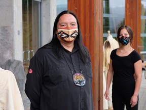 A7xwil Travis Billy and Sutikem Bikadi wear handmade masks designed by Indigenous artists. The colourful masks are available for sale at the Squamish Lil'wat Cultural Centre in Whistler.
