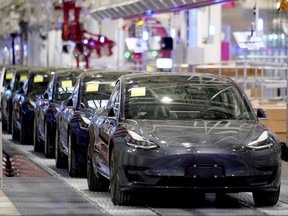 China-made Tesla Model 3 vehicles are seen during a delivery event at its factory in Shanghai, China on Jan. 7, 2020.