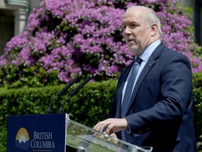 B.C. Premier John Horgan provides the latest update on the COVID-19 response in the province during a press conference from the rose garden at Legislature in Victoria, B.C., on Wednesday, June 3, 2020.