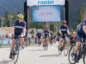 Outgoing CFO of Concert Properties John McLaughlin passes the finish line at the 2019 Ride to Conquer Cancer Vancouver in Hope, B.C., along with his colleagues.