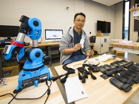 Dr. Woo Soo Kim, an SFU Surrey engineering professor who has been using his 3D printer to make door handles that can be opened with a person's forearm instead of their hands. His students have been using their personal 3D printers to make about 50 handles that have been installed in the offices at Surrey City Hall as part of a pilot project.