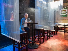 Vince Marino, co-owner of the Pumpjack Pub in Vancouver's West End, was able to re-open in May with various physical distancing measures, Plexiglas screens and reduced capacity.