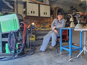 Vancouver Island artist Ian Lowe in his Royston, B.C., studio next to two stainless steel sculptures, one of which he gifted to B.C.'s public health officer, Dr. Bonnie Henry.