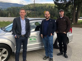 Rik Logtenberg, Keith Page and Jesse Woodward in front of the city of Nelson's Kootenay car share.