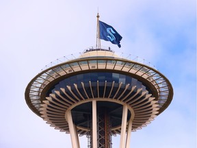 The logo of Seattle's new NHL franchise, the Kraken, is displayed on top of the Space Needle in Seattle, Wash. on Thursday.