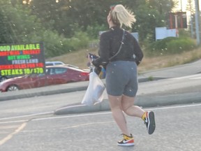 Coquitlam police are searching for a woman with unique sneakers who allegedly punched a driver in a road rage incident earlier this month.