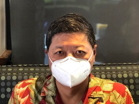 Vernon Lau, general manager of Alais Ventures in Richmond, B.C., displays the company’s KN95 mask.