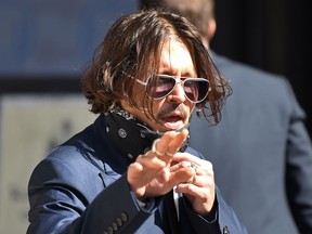 Hollywood actor Johnny Depp arrives on the first day of his libel trial against News Group Newspapers (NGN), at the High Court in London, on July 7, 2020.