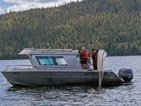 Researchers from the University of Northern British Columbia use a net to collect plankton for metal analysis from Quesnel Lake.