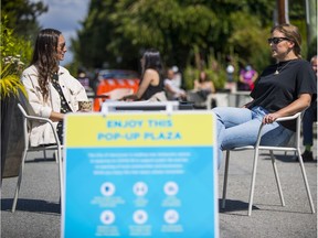 Kyla Jamieson, left, and Emma Sims live near the pop-up plaza at on West 14th at the corner of Granville Street.