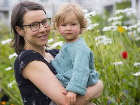 Dr. Vanessa Brcic and her two-year-old daughter Pema in the community garden that has been their lifesaver since playgrounds closed due to the COVID-19 pandemic.