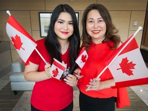 Danielle (left) and Catherina Tan became Canadian citizens on Canada Day during a virtual ceremony. Photographed at their home in North Vancouver, B.C., July 1, 2020.