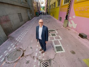 Charles Gauthier, CEO of the Downtown Vancouver Business Improvement Association, stands in the brightly coloured Alley Oop of which he’s proud on Wednesday.