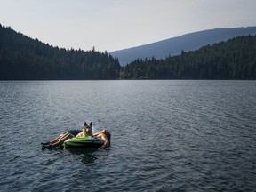 Crowds eager to escape COVID-19 confinement are contributing to a number of fights, traffic issues and intoxication at Sasamat Lake, pictured, and White Pine Beach, according to a warning issued by police.