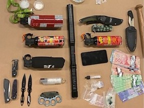 Weapons, cash and drugs seized by CFSEU in Kelowna over the long weekend.