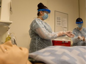 Thompson Rivers University nursing students, practising personal protective equipment protocols, will have a new peer-support network, Nursing the Future, launched by one of their professors as some extra backup to guide the start of their careers.