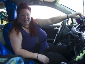 Michelle Kaiser, (a.k.a. The Gypsy Mermaid) in her car she calls Cosmic Waters, drives for Uber and Lyft. Pictured in Richmond on Aug. 17.