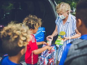 Joanne Griffiths, executive director and co-founder of Backpack Buddies, delivers weekend meals to children in need.