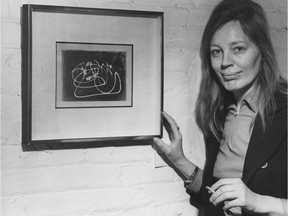 Jytte Allen is shown in 1973 with a work by Mark Tobey, a U.S. artist, in Galerie Allen which she operated in Gastown. Photo: Dan Scott/PNG Merlin Archive