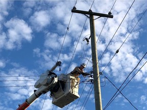 B.C. Hydro power line technician Simon Gregg. Staff at the electric utility adapted to new COVID-19 protocols to keep critical infrastructure working.