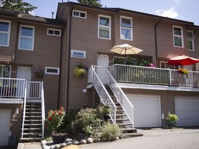 595 Carlsen Place in Port Moody, with yellow umbrella, is the subject of a lawsuit by B.C.'s director of civil forfeiture.