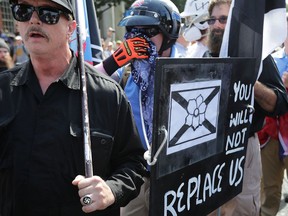 Hundreds of white nationalists, neo-Nazis and members of the ‘alt-right’ march during the United the Right rally on Aug. 12, 2017 in Charlottesville, Va.