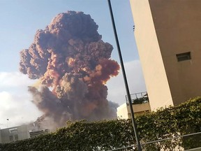 Smoke rises after an explosion in Beirut, Lebanon August 4, 2020, in this picture obtained from a social media video.