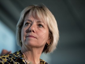 British Columbia provincial health officer Dr. Bonnie Henry listens during a news conference regarding COVID-19, in Vancouver, on Saturday, March 14, 2020. The provincial health officer says a back-to-school ad being criticized by the B.C. Teachers' Federation as unrealistic wasn't meant to be a commercial about what classrooms would look like.