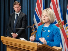 B.C. Education Minister Rob Fleming looks on as Province Health Officer Dr. Bonnie Henry announces enhanced safety measures and resources that will enable most students to return to B.C. schools in September, amid the ongoing COVID-19 pandemic.