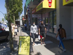 Shoppers on 137th Street in Surrey, one of the stretches studied for a Vancity report on business resiliency.