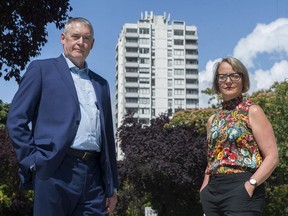 Vancouver, BC: AUGUST 12, 2020 --  Jill Atkey, CEO of the BC Non-Profit Housing Association, and Thom Armstrong, CEO Cooperative Housing Federation of BC, with 1501 Haro Street apartment in the background Wednesday, August 12, 2020.