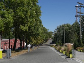 The road in front of the barns at the PNE sit empty instead of the usual vendor booths. In years past, work crews and equipment would be in place in preparation for the annual fair.