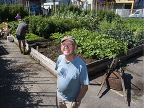 University of B.C. Prof Patrick Moore poses for a photo in the urban farm next to the Astoria Hotel in Vancouver on Aug. 10.
