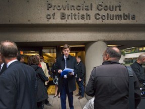 Attorney General David Eby outside the provincial court building in Vancouver.