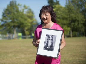 Carol Todd holds a photo of her daughter Amanda Todd, the 15-year-old who committed suicide in October 2012 after being bullied online.