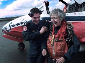 Kay Alsop gets fitted for a parachute before getting into a Snowbird at the Vancouver airport in 1996.