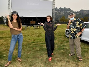Director Chloe Zhao, star Frances McDormand and Fox Searchlight Co-Chairman Stephen Gilula (left to right) at the drive-in premiere of Nomadland hosted by Fox Searchlight and The Telluride Film Festival at the Rose Bowl in Pasadena, Calif., on Sept. 11, 2020.