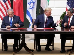 (L-R) Prime Minister of Israel Benjamin Netanyahu, U.S. President Donald Trump, and Foreign Affairs Minister of the United Arab Emirates Abdullah bin Zayed bin Sultan Al Nahyan participate in the signing ceremony of the Abraham Accords on the South Lawn of the White House on September 15, 2020 in Washington, DC. Witnessed by President Trump, Prime Minister Netanyahu signed a peace deal with the UAE and a declaration of intent to make peace with Bahrain.