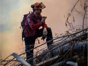 A B.C. Wildfire Service firefighter at the Doctor Creek blaze in southeast B.C.