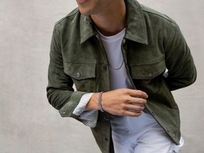 Model Tyler Joe wears pieces from the new Mejuri men's collection.