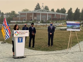 Bowinn Ma, the B.C. parliamentary secretary for TransLink and North Vancouver Lonsdale MLA, at the podium while TransLink vice-president Steve Vanagas, Vancouver South MP Harjit Sajjan and Vancouver Mayor Kennedy Stewart look on at Thursday, Sept. 17, 2020 announcement on the station names for the Broadway Subway Project.