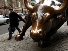 The iconic bronze bull in the Wall Street financial district in New York in a file photo.